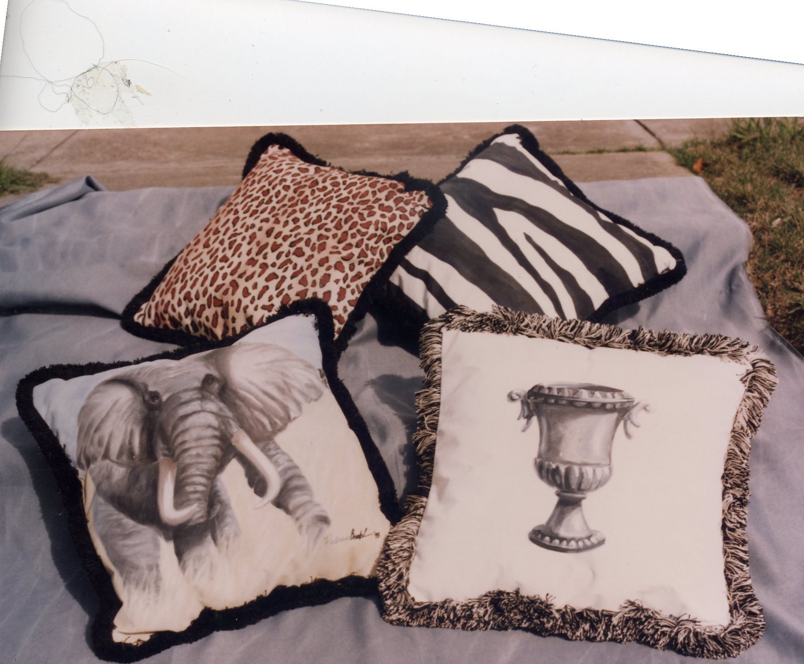Painted pillows, elephant and zebra